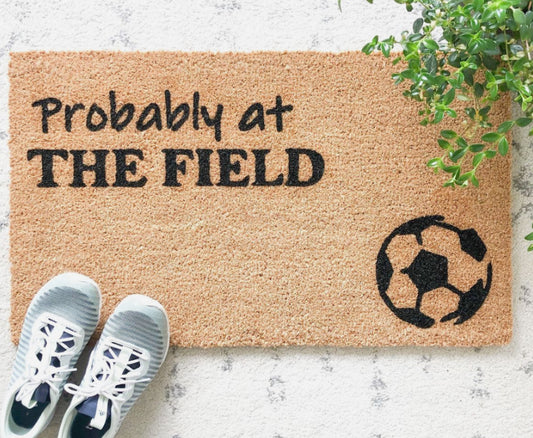 Probably at the soccer field doormat